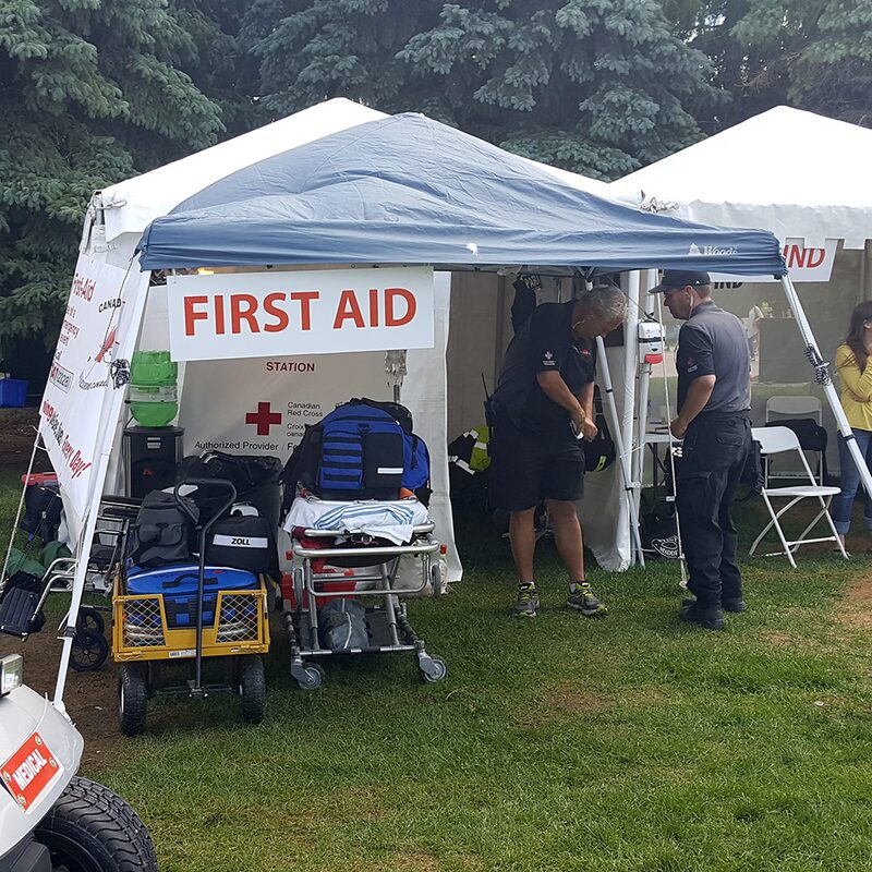 Inside an event first aid station with a stretcher, monitors and response bags